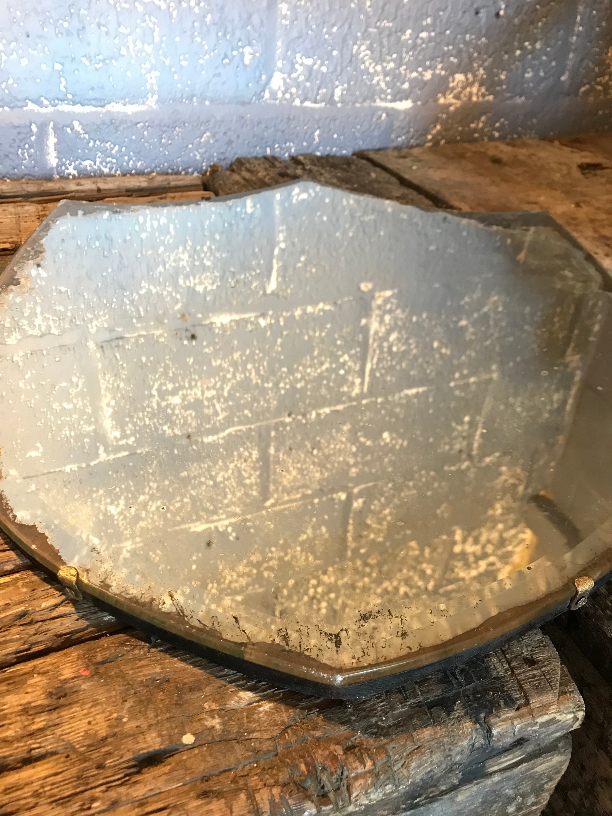 A large shield design bevelled Art Deco mirror