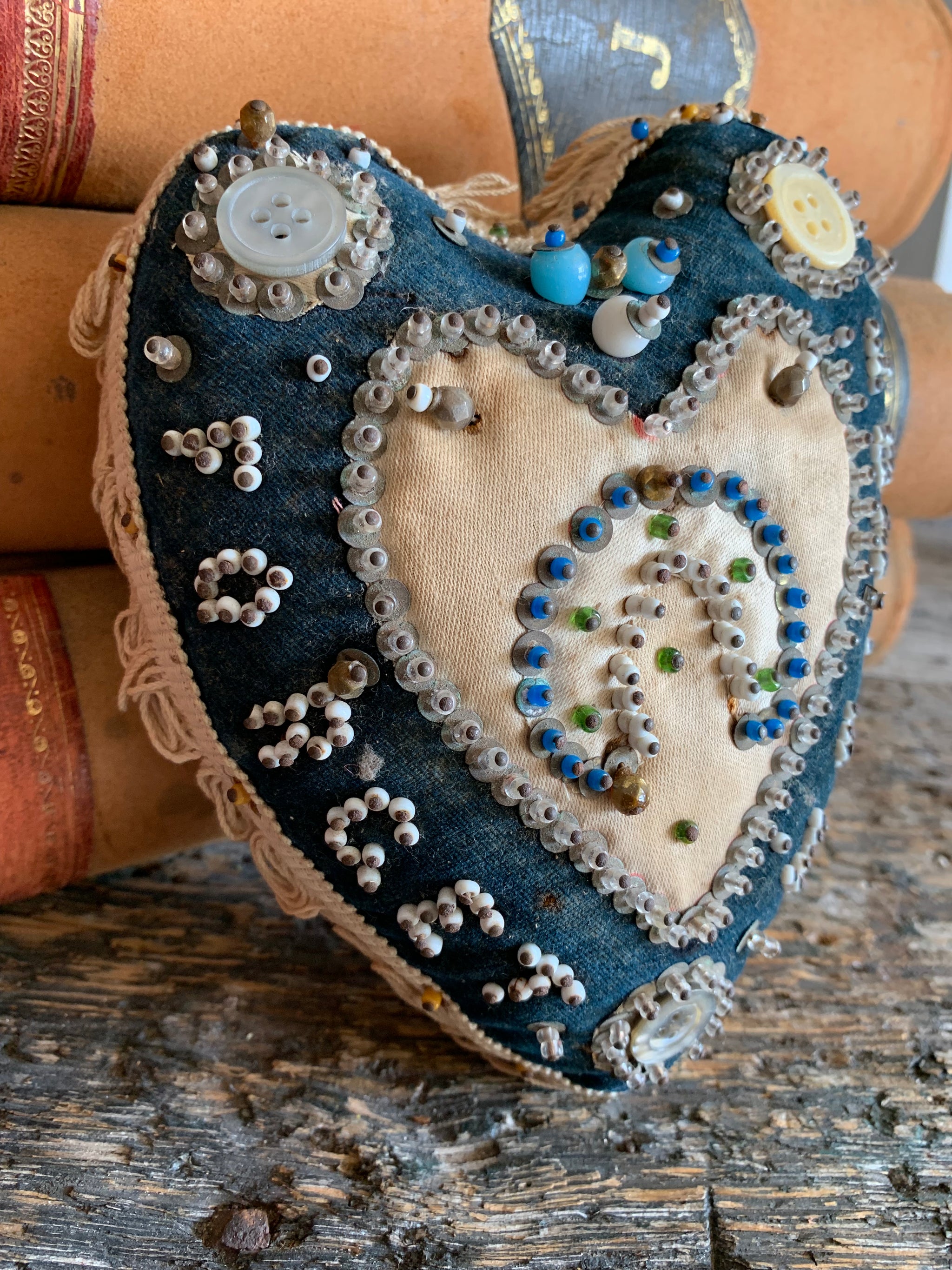 A First World War forget-me-not sweetheart pin cushion