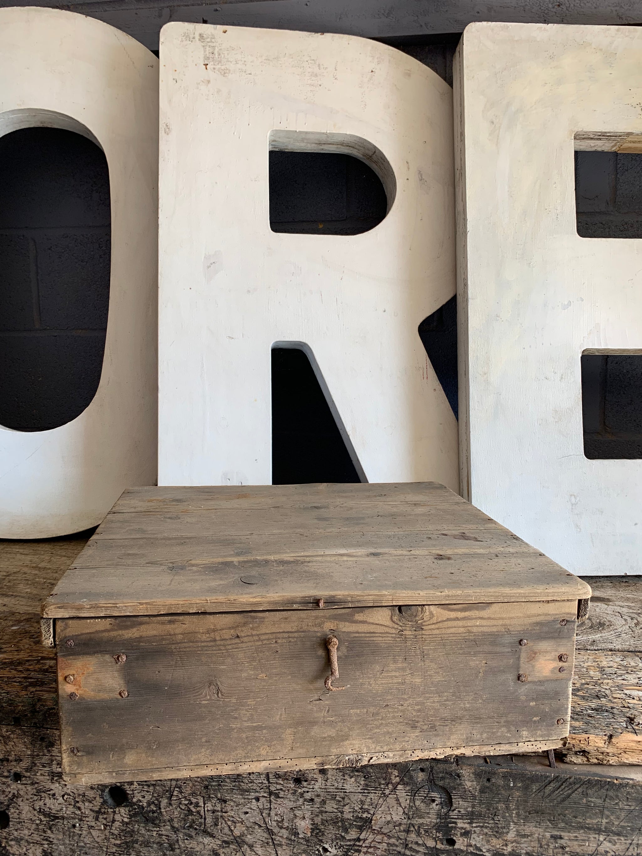 A set of eight wooden lignum vitae lawn bowls in a wooden box