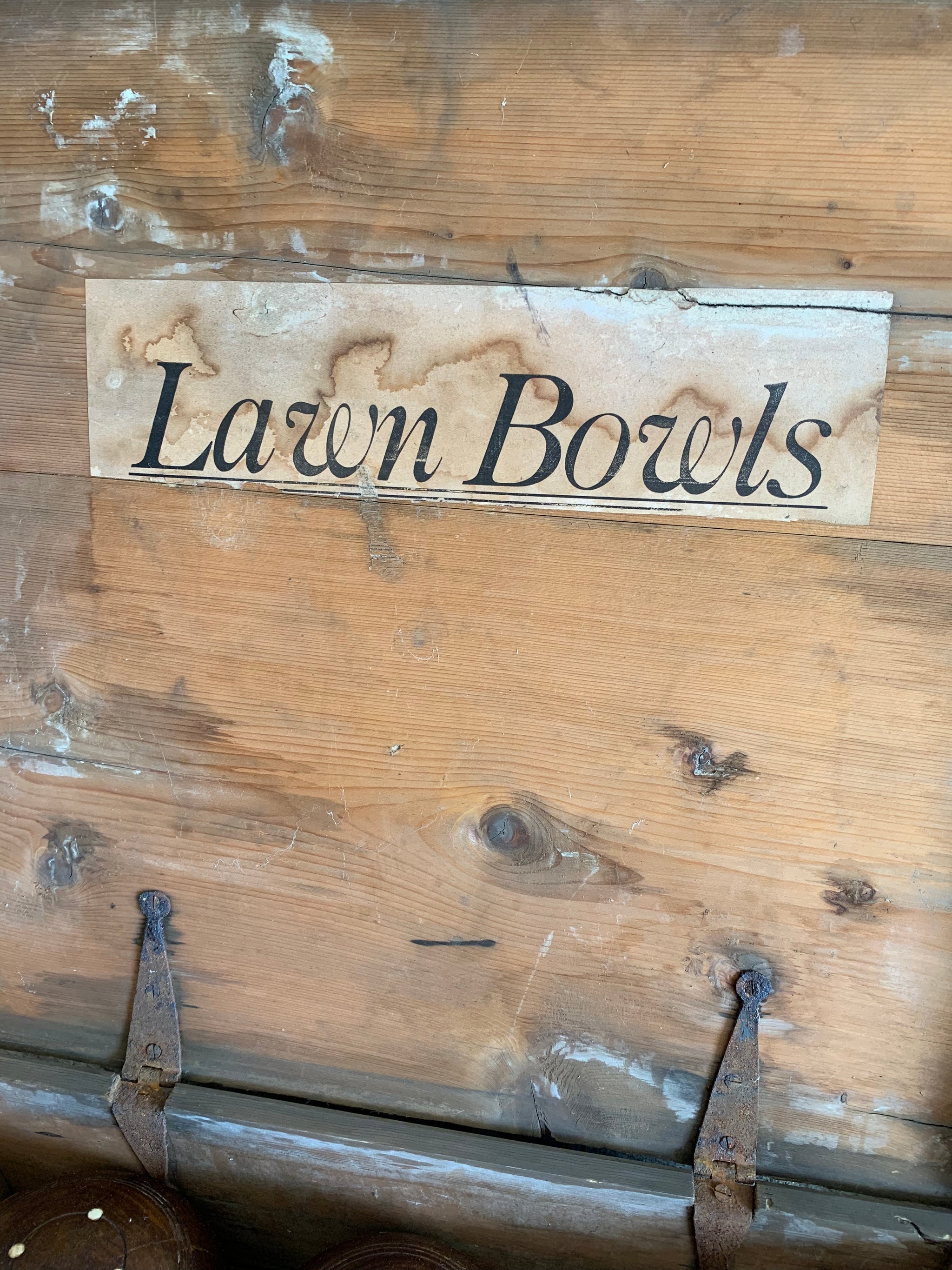 A set of eight wooden lignum vitae lawn bowls in a wooden box