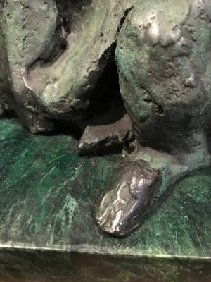 A verdigris bronze cire perdue pig sculpture on a green marble base