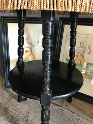 An early ebonised gypsy table with mustard velvet top
