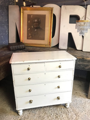 A white painted Victorian chest of drawers