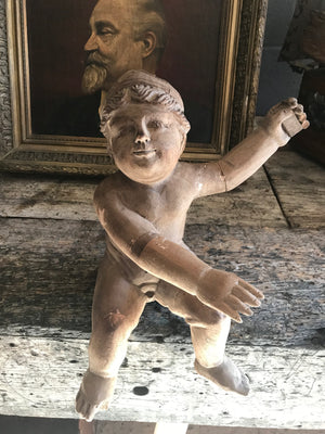A large 19th Century carved wooden cherub putto figure