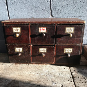 A bank of apothecary drawers