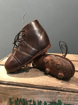 A pair of child’s vintage leather football or rugby boots