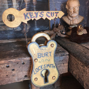 A Victorian style locksmith trade sign
