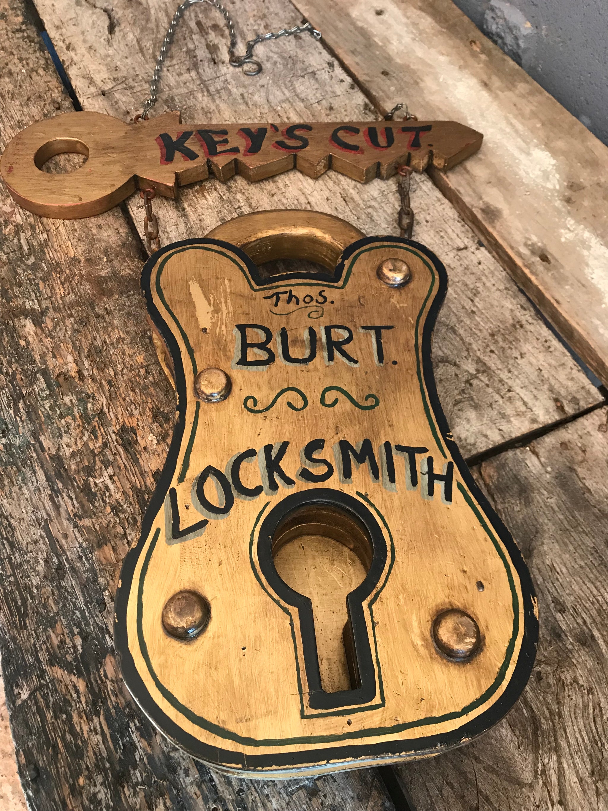 A Victorian style locksmith trade sign