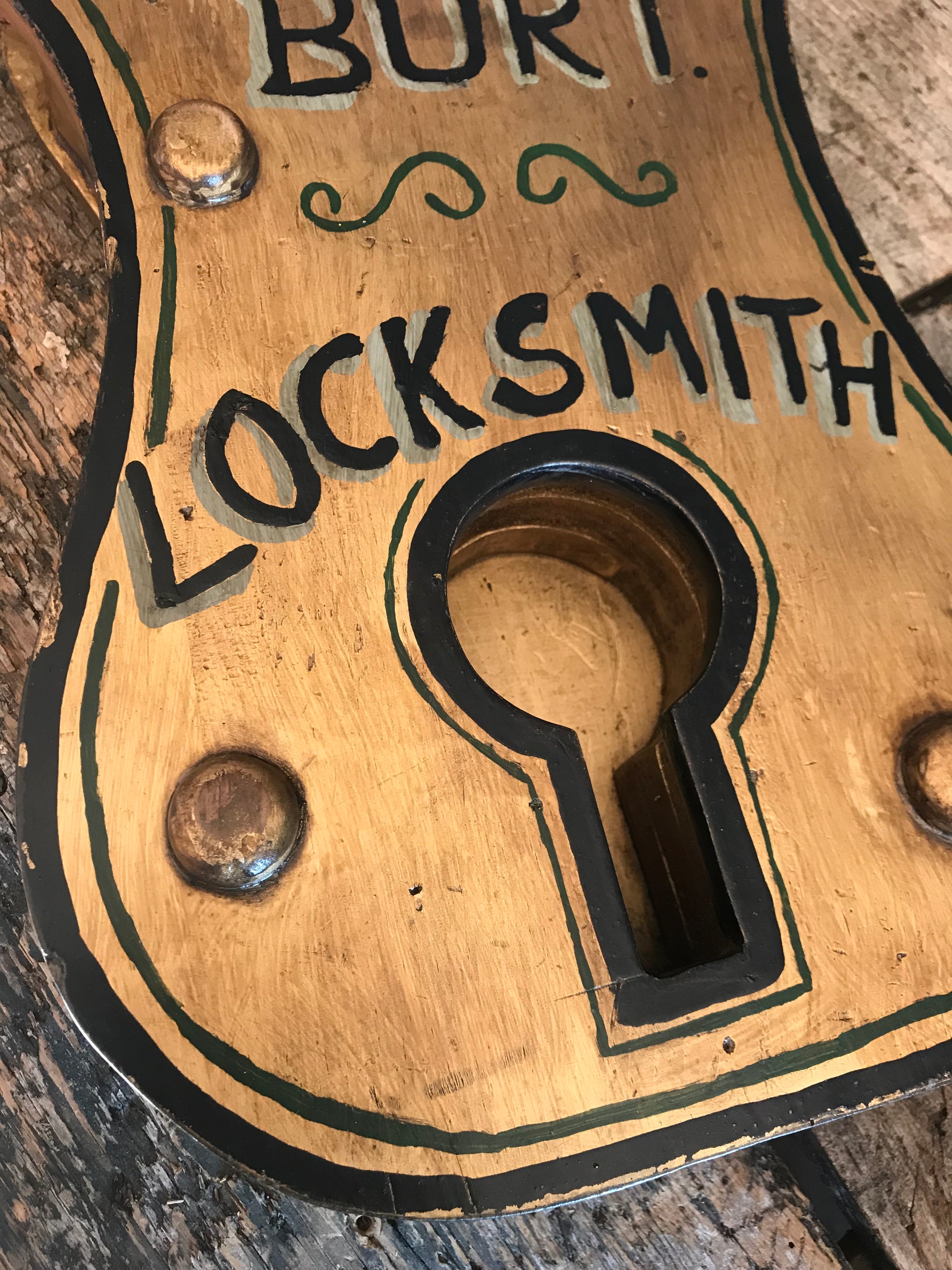 A Victorian style locksmith trade sign