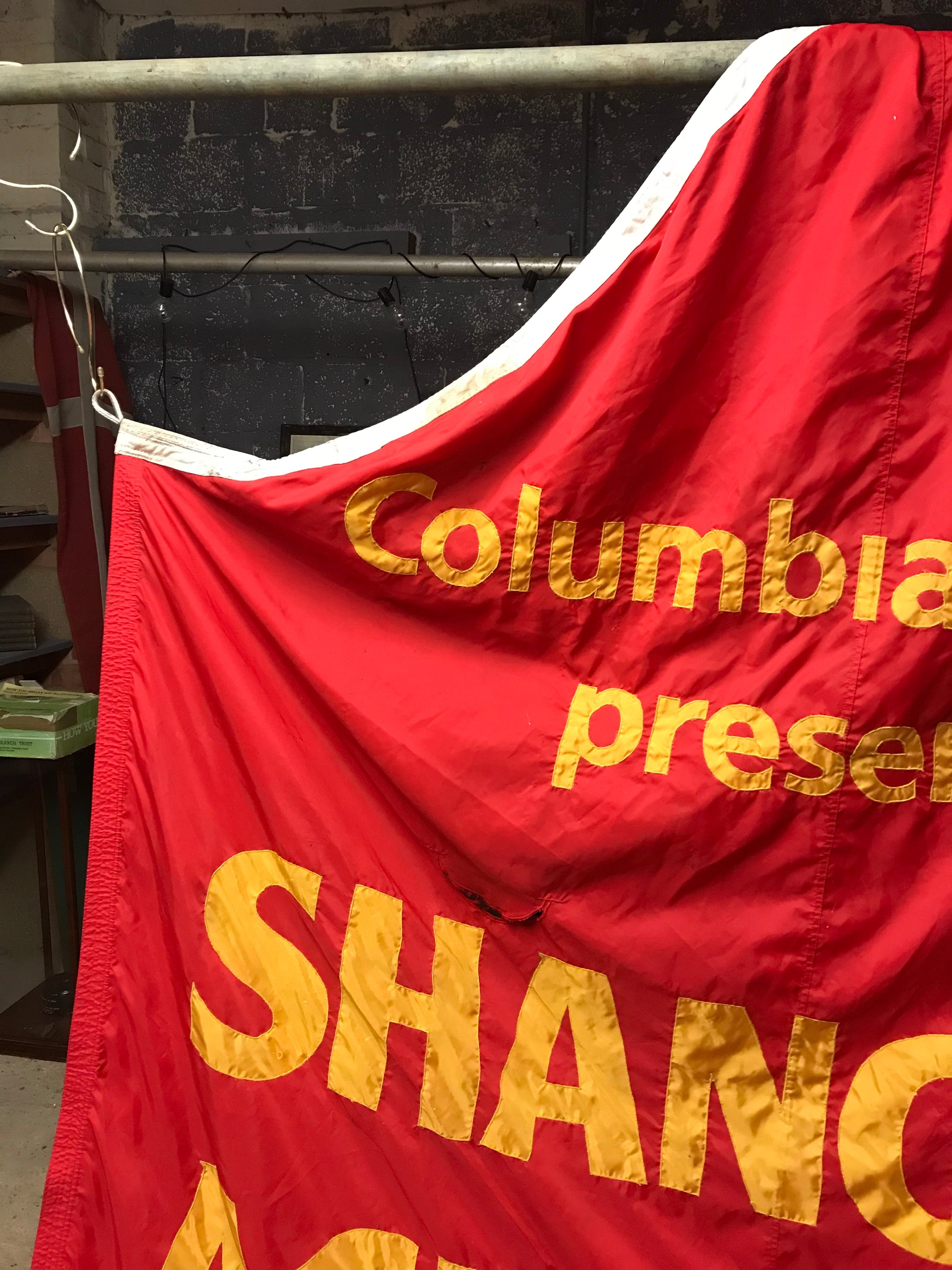 A large fairground or circus style Shanghai Acrobatic Theater of China banner