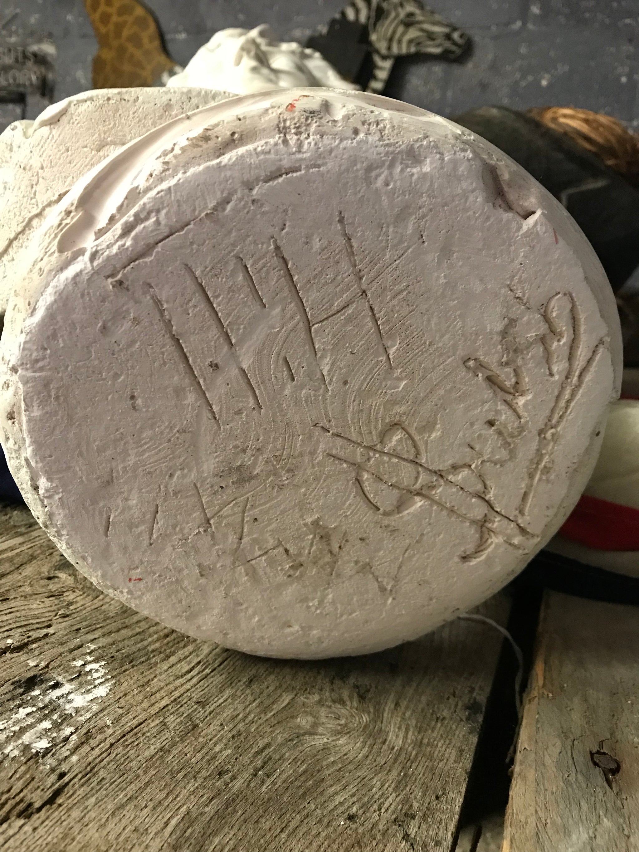 A large Neoclassical Roman bust in white plaster