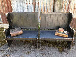 A pair of 19th Century black painted pews