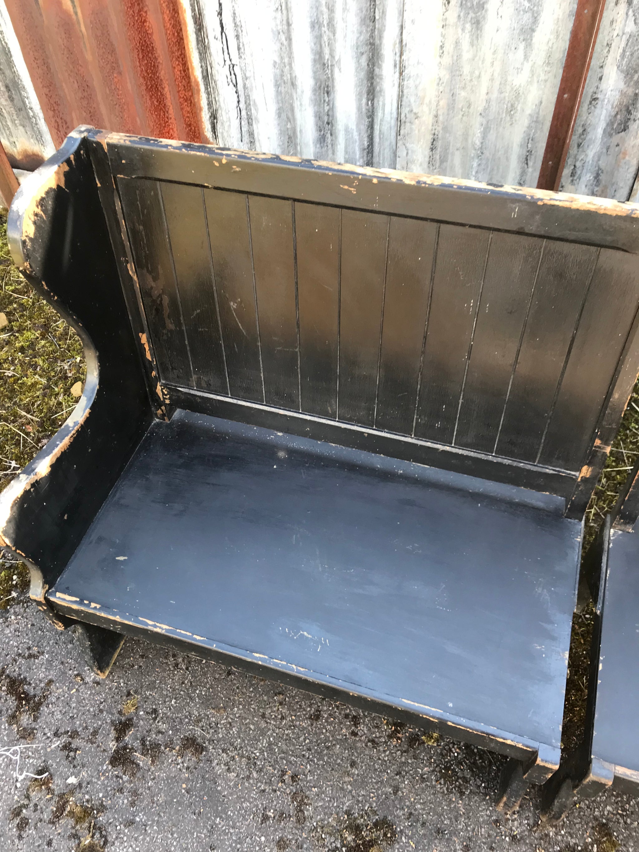 A pair of 19th Century black painted pews