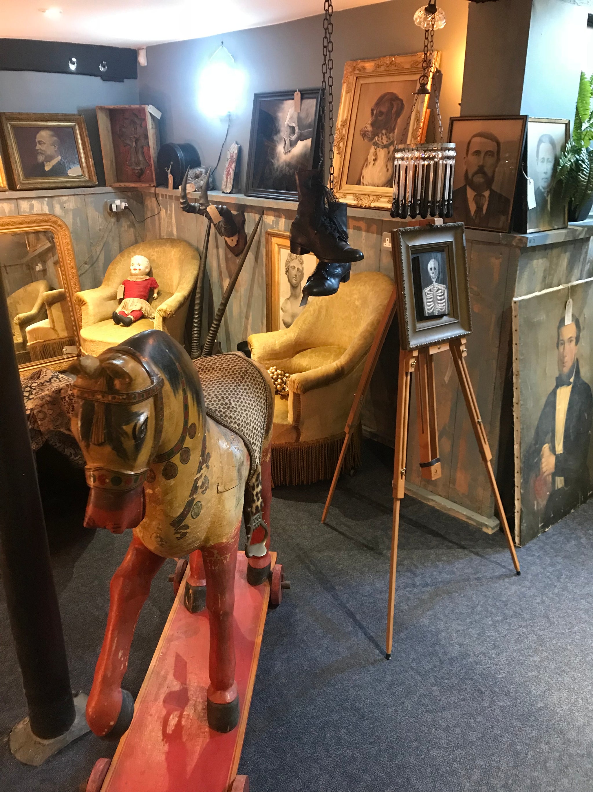 A large 19th Century Persian polychrome painted rocking horse on wheels