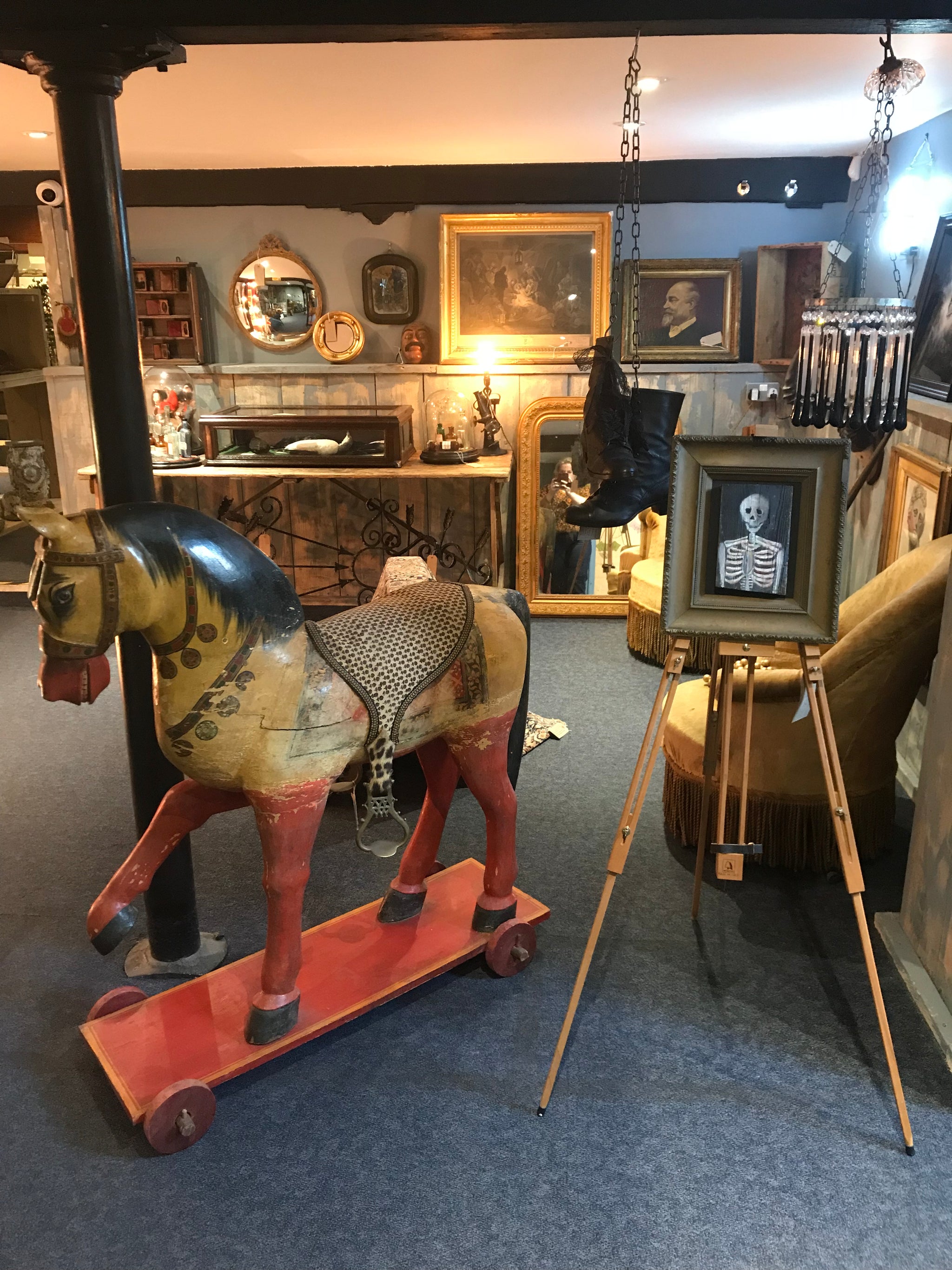 A large 19th Century Persian polychrome painted rocking horse on wheels