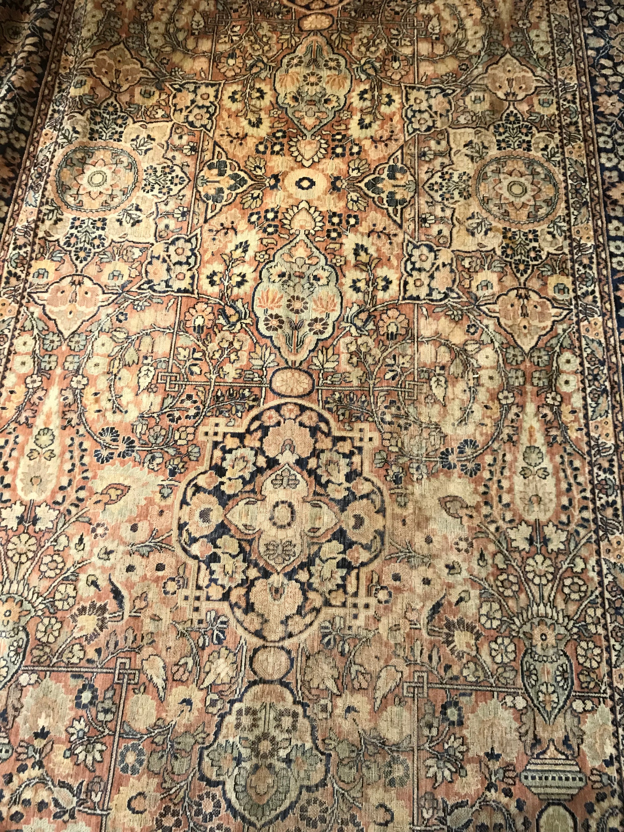 A rectangular blue ground Persian rug runner