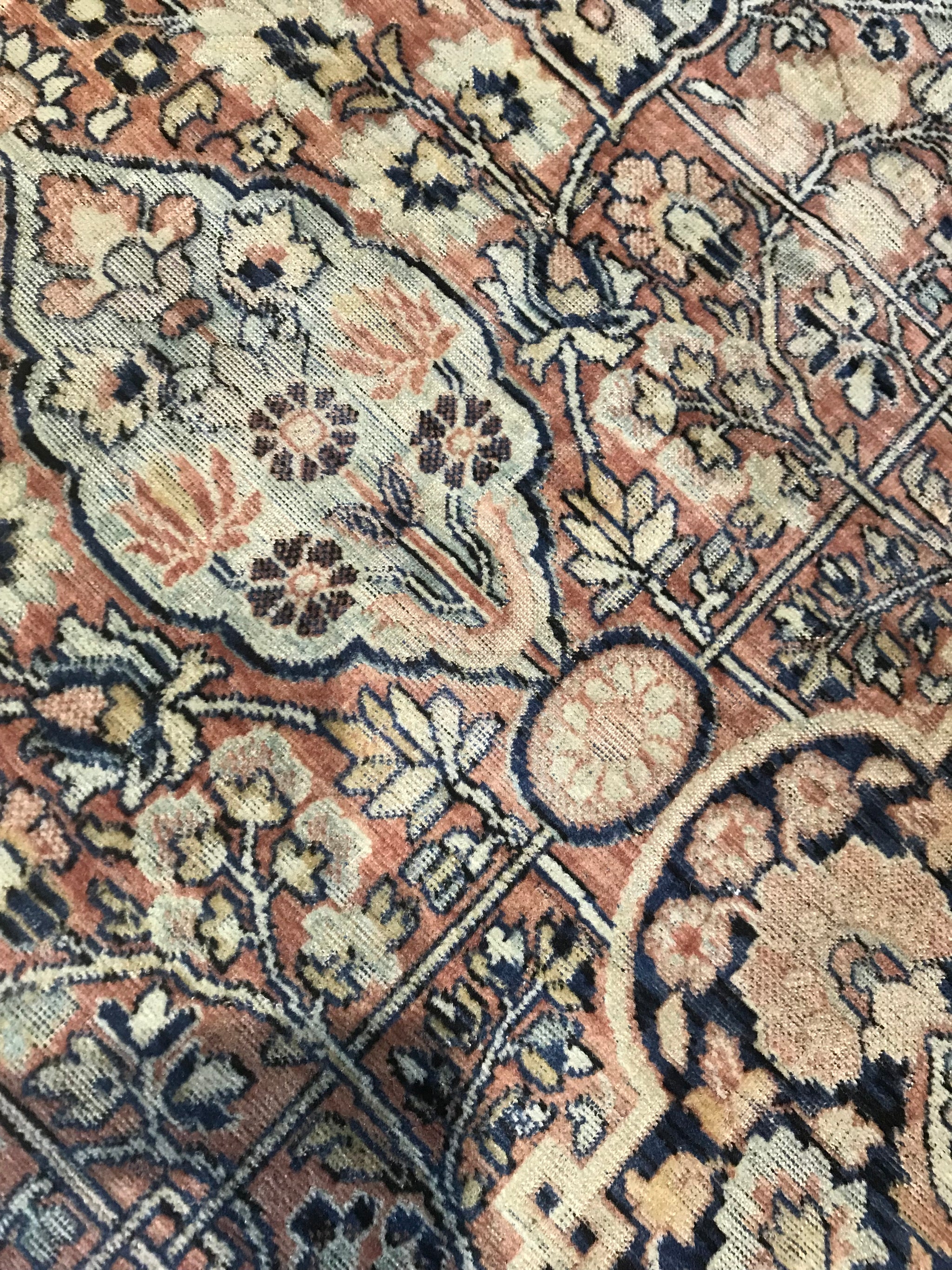 A rectangular blue ground Persian rug runner