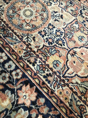 A rectangular blue ground Persian rug runner