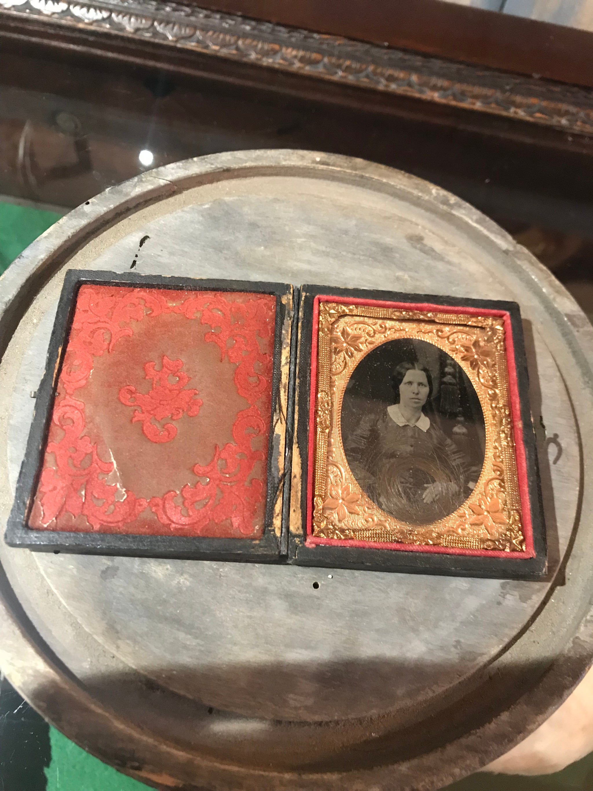 A 19th Century daguerreotype cased photograph of a lady with a lock of hair