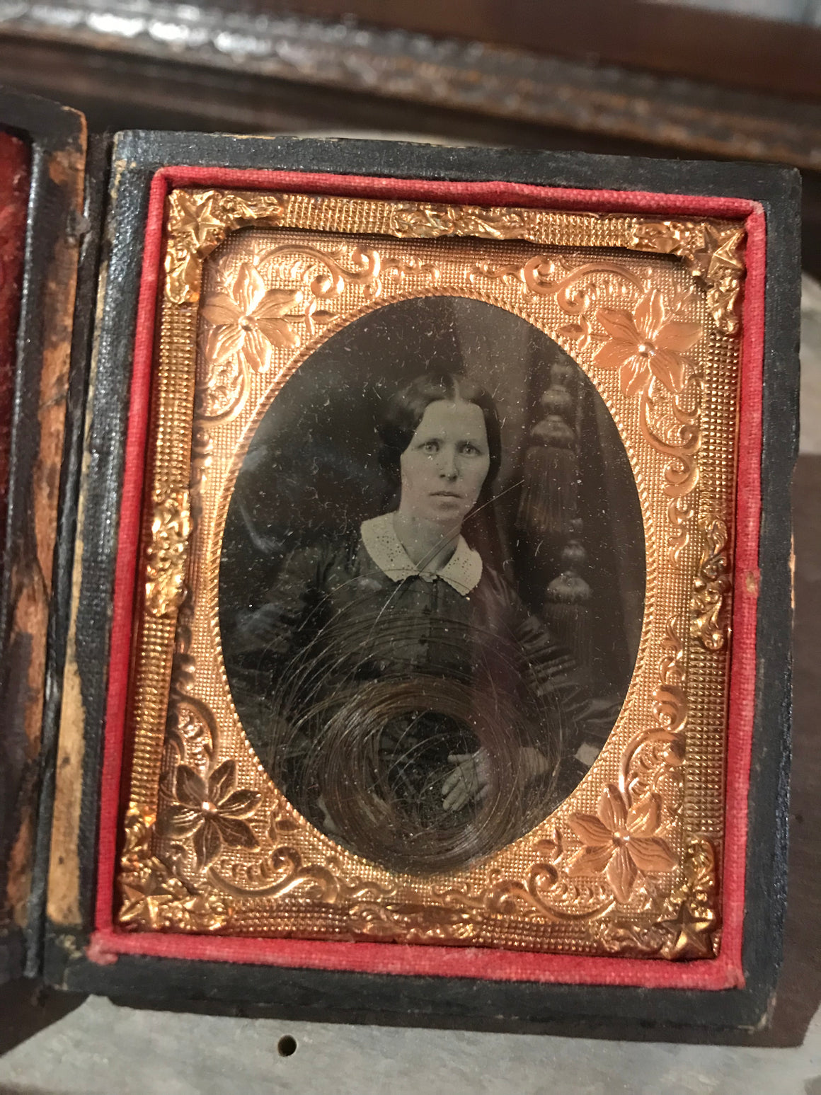 A 19th Century daguerreotype cased photograph of a lady with a lock of hair
