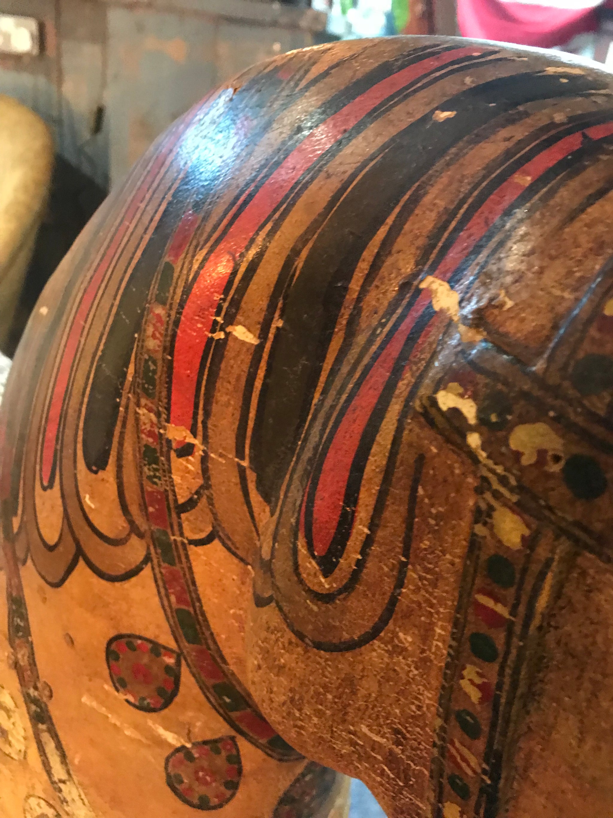 A large 19th Century Persian polychrome painted rocking horse on wheels