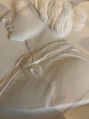 A 19th century bas relief plaster portrait of a lady