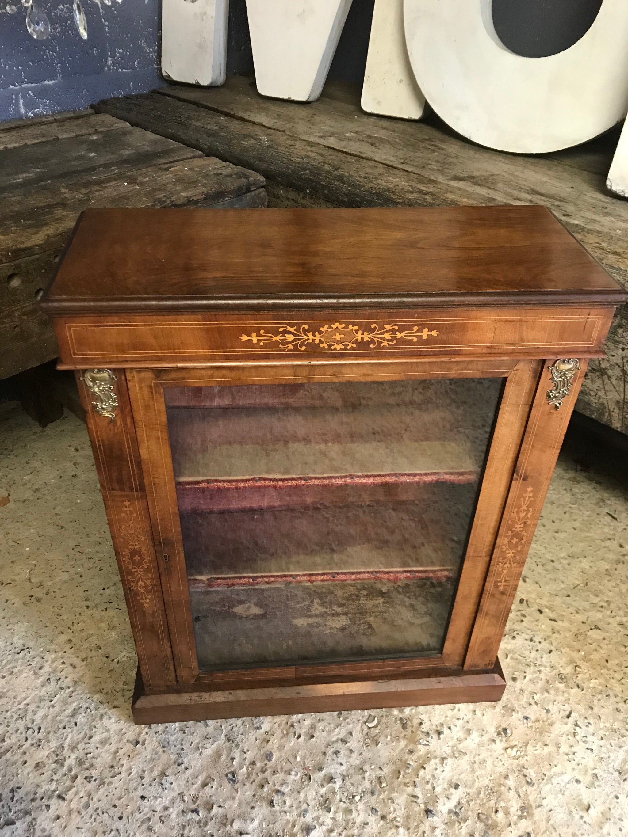 A Victorian single door inlaid walnut pier display cabinet