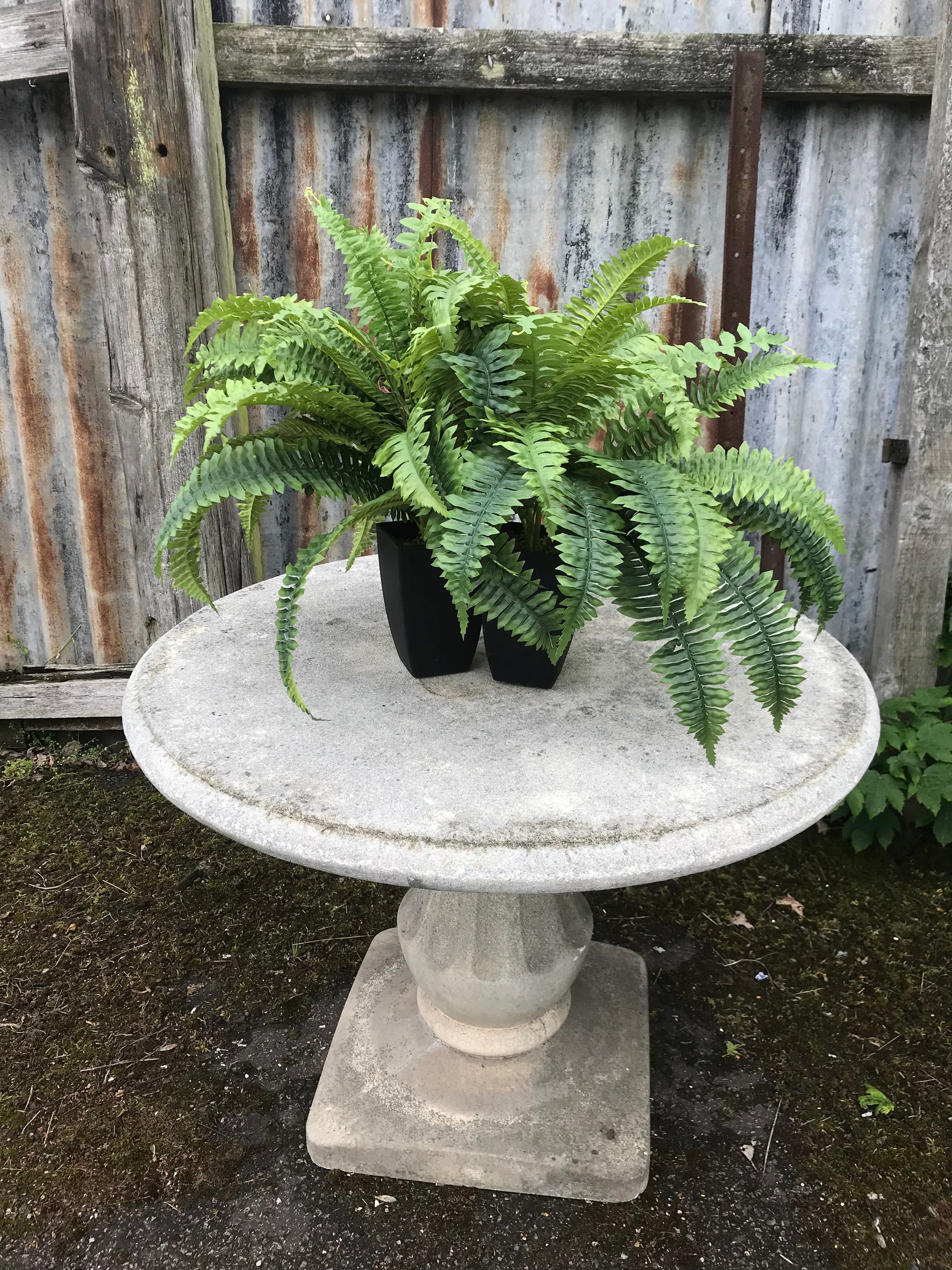 A French cast stone round top pedestal garden table by Grandon Fres