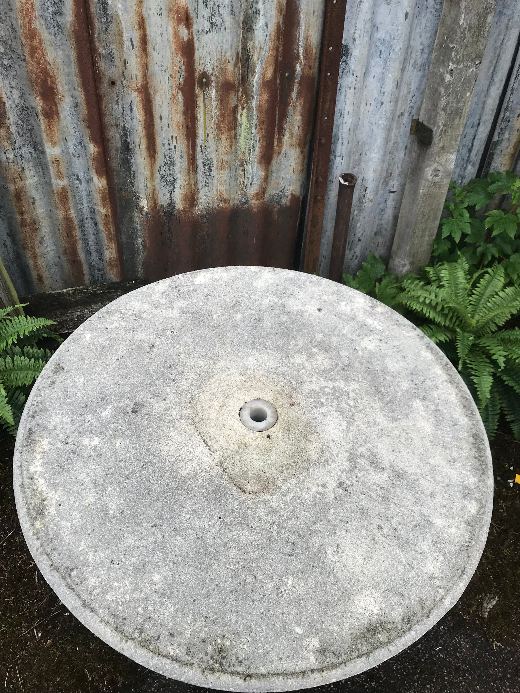 A French cast stone round top pedestal garden table by Grandon Fres