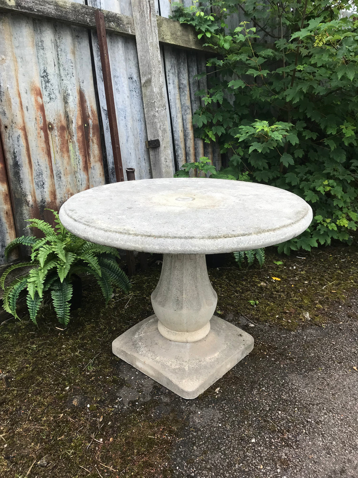 A French cast stone round top pedestal garden table by Grandon Fres
