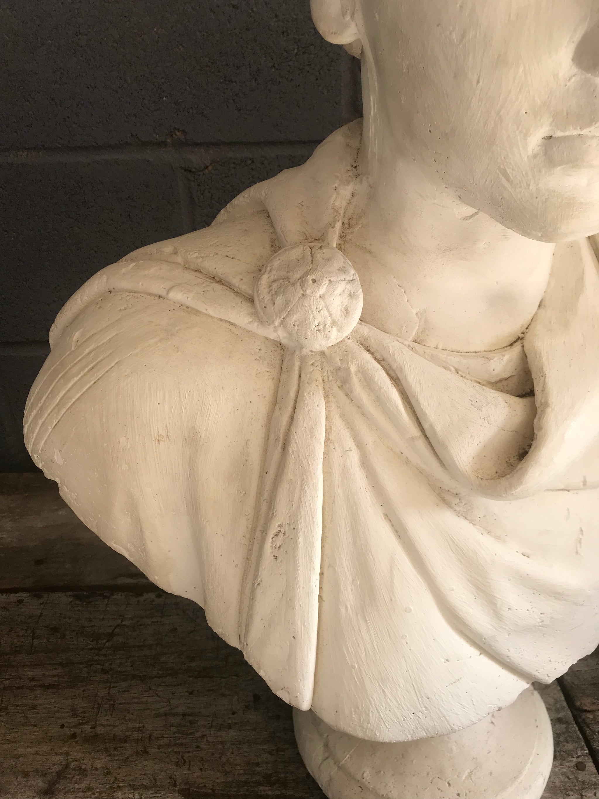 A large Neoclassical Roman bust in white plaster