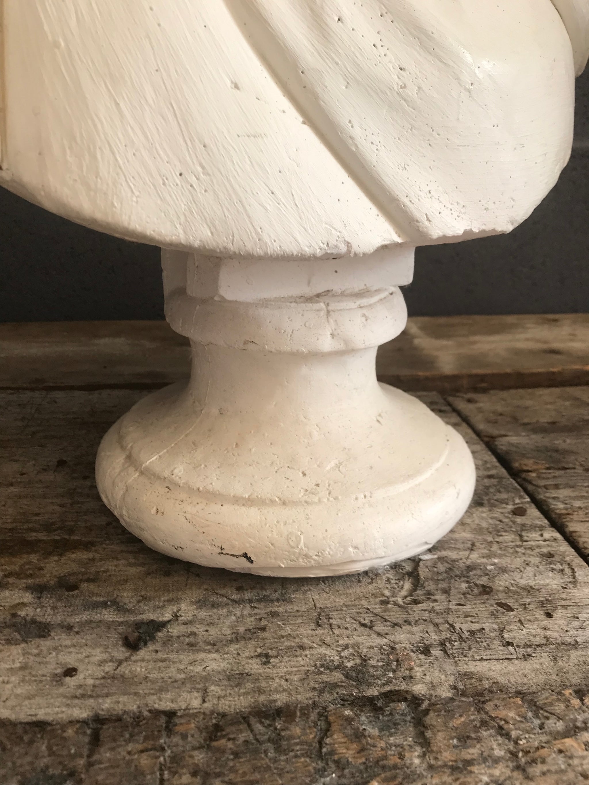 A large Neoclassical Roman bust in white plaster