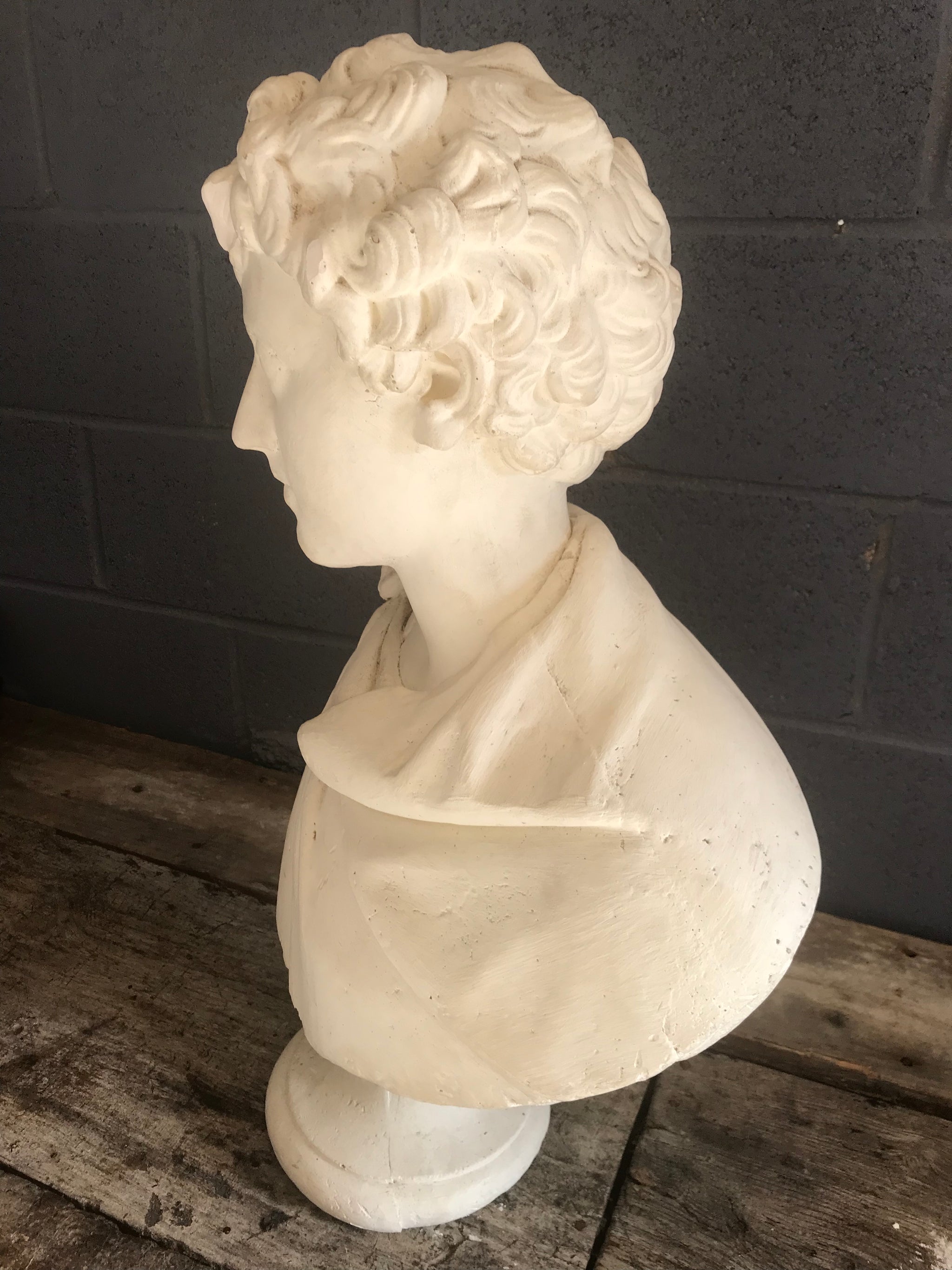 A large Neoclassical Roman bust in white plaster