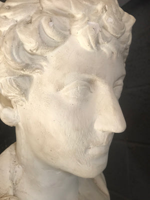 A large Neoclassical Roman bust in white plaster