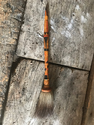 A large carved polychrome oriental calligraphy brush