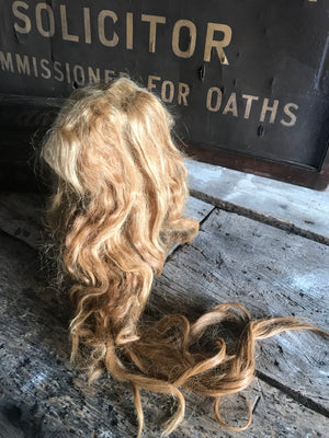 A vintage theatrical real hair wig of long red locks
