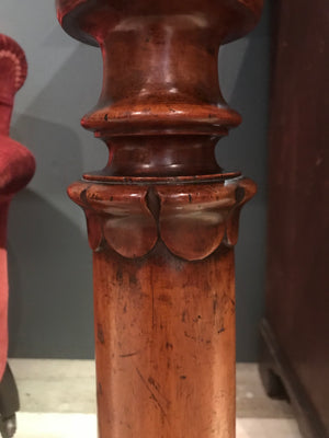 A small wooden torchere display stand with acanthus leaf detail