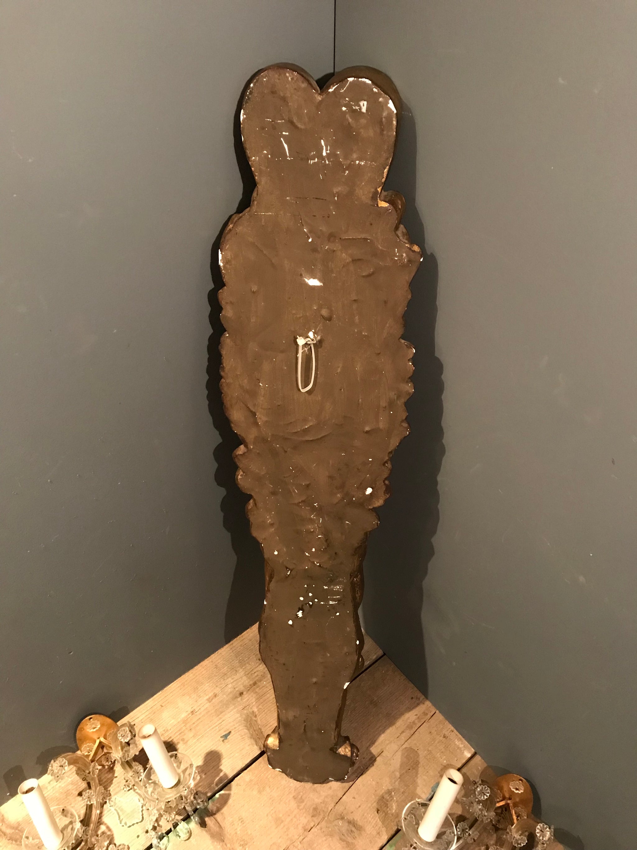 A gilt classical putto plaster wall plaque