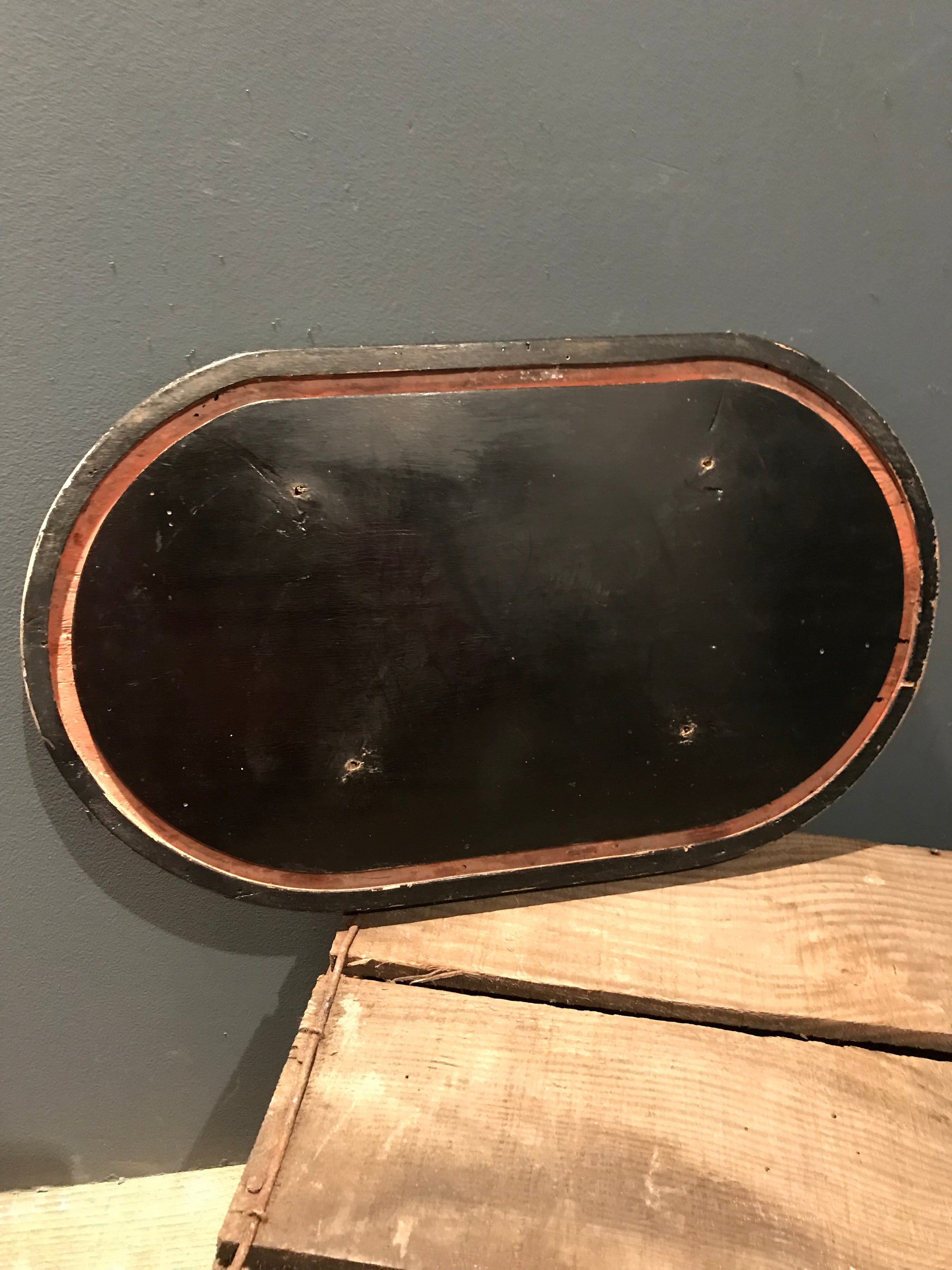 An ebonised glass display dome