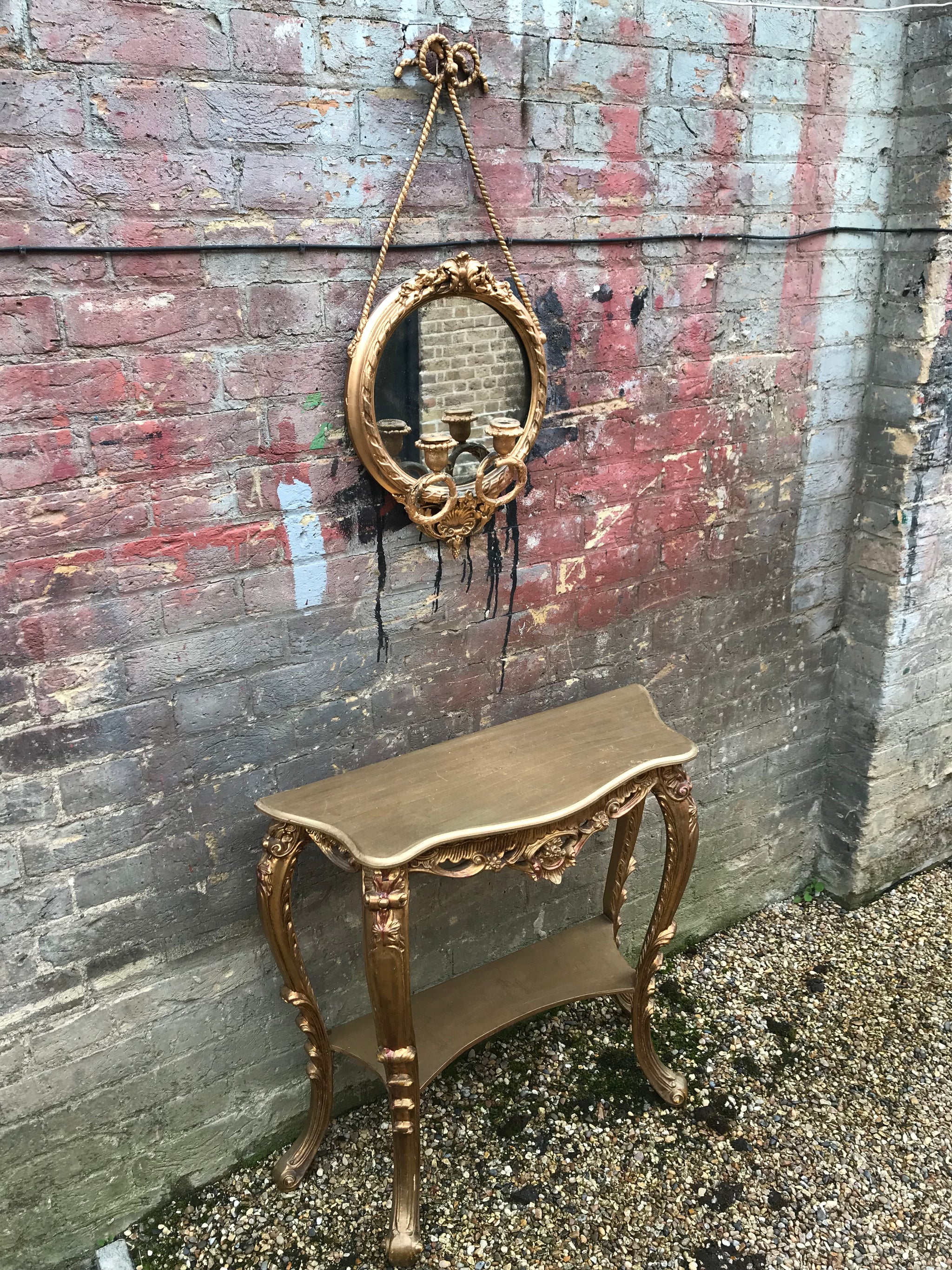 A round Rococo girandole mercury mirror