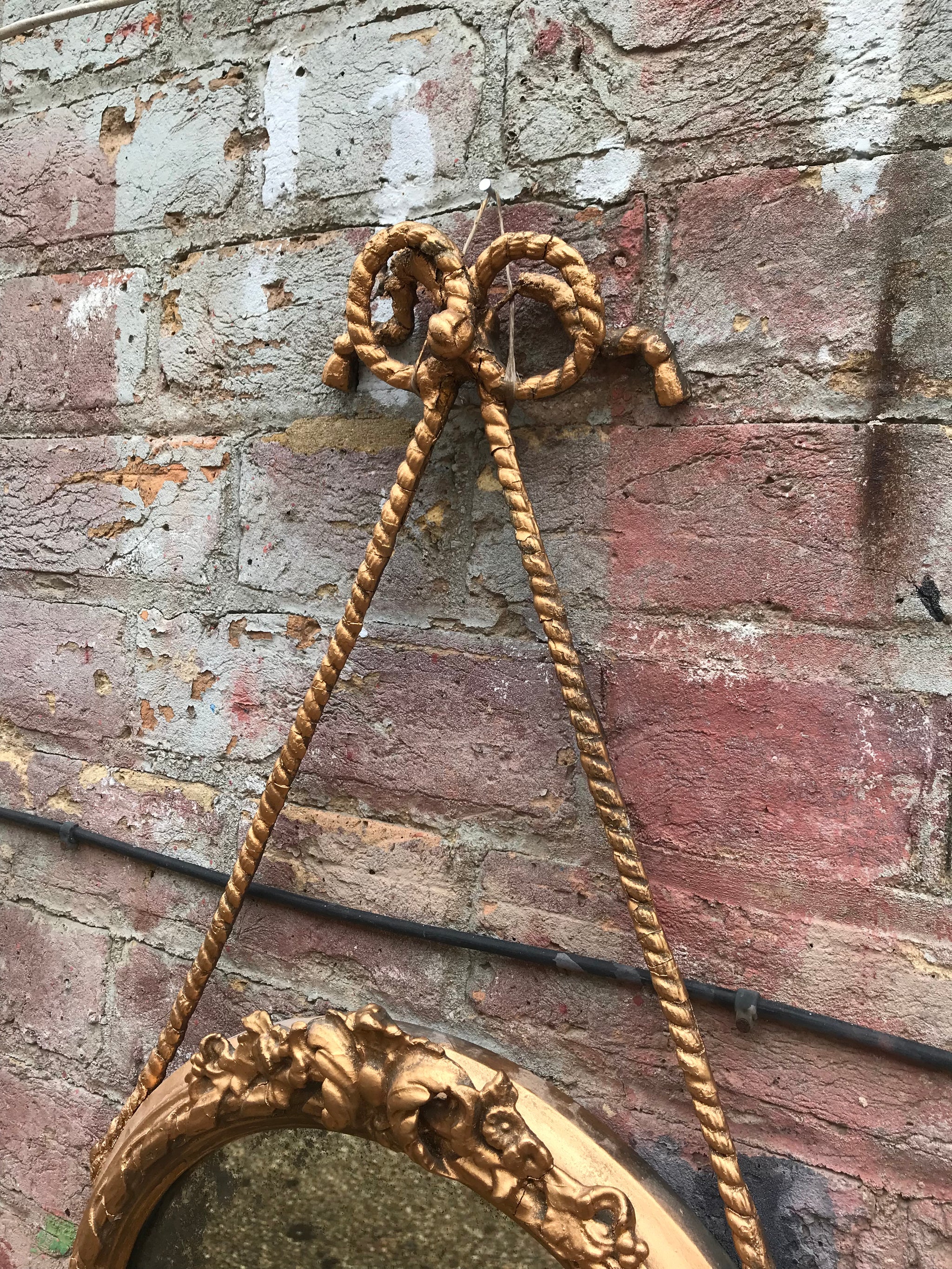 A round Rococo girandole mercury mirror