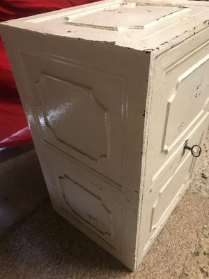 A white cast iron strong box safe with key