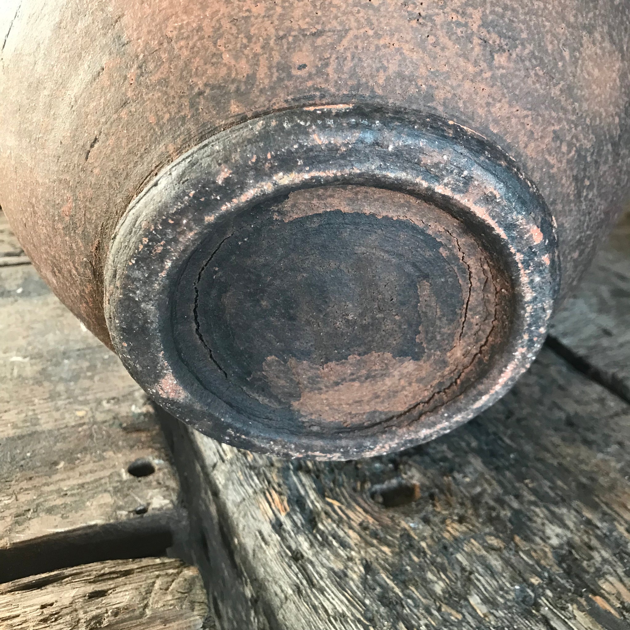 A pair of large terracotta urns with double lug handles
