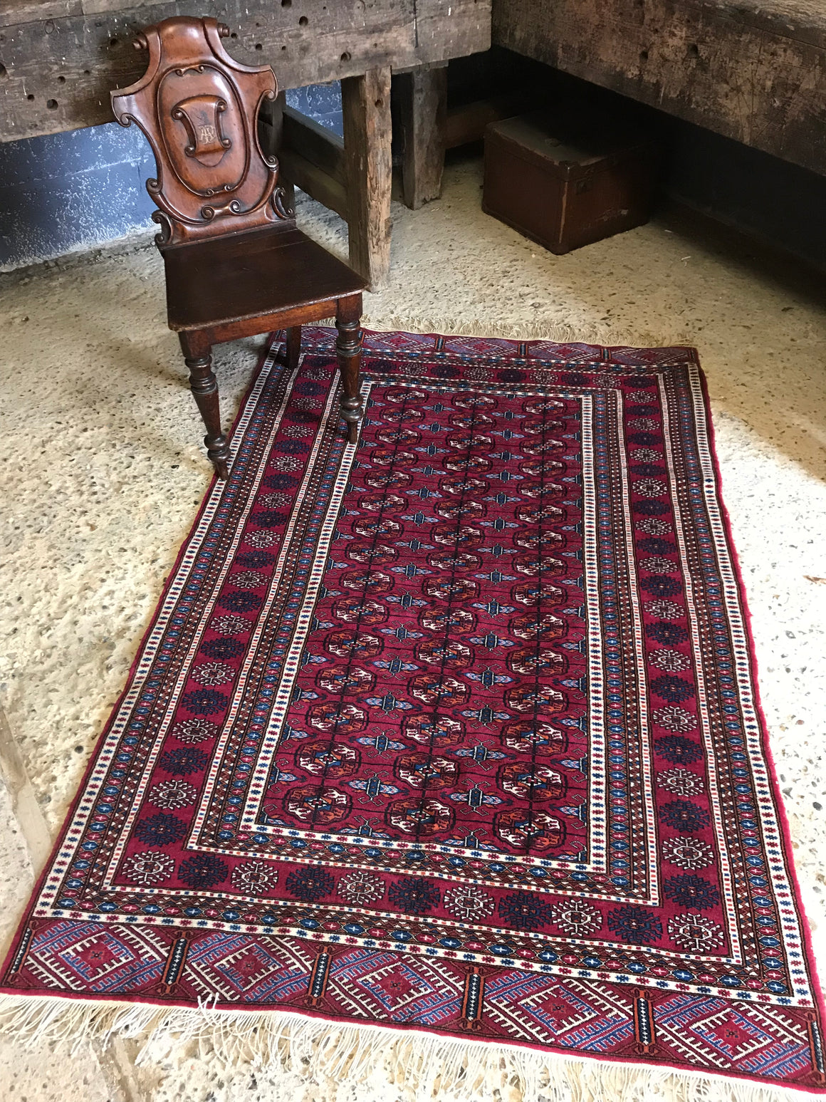 A rectangular red ground Persian rug