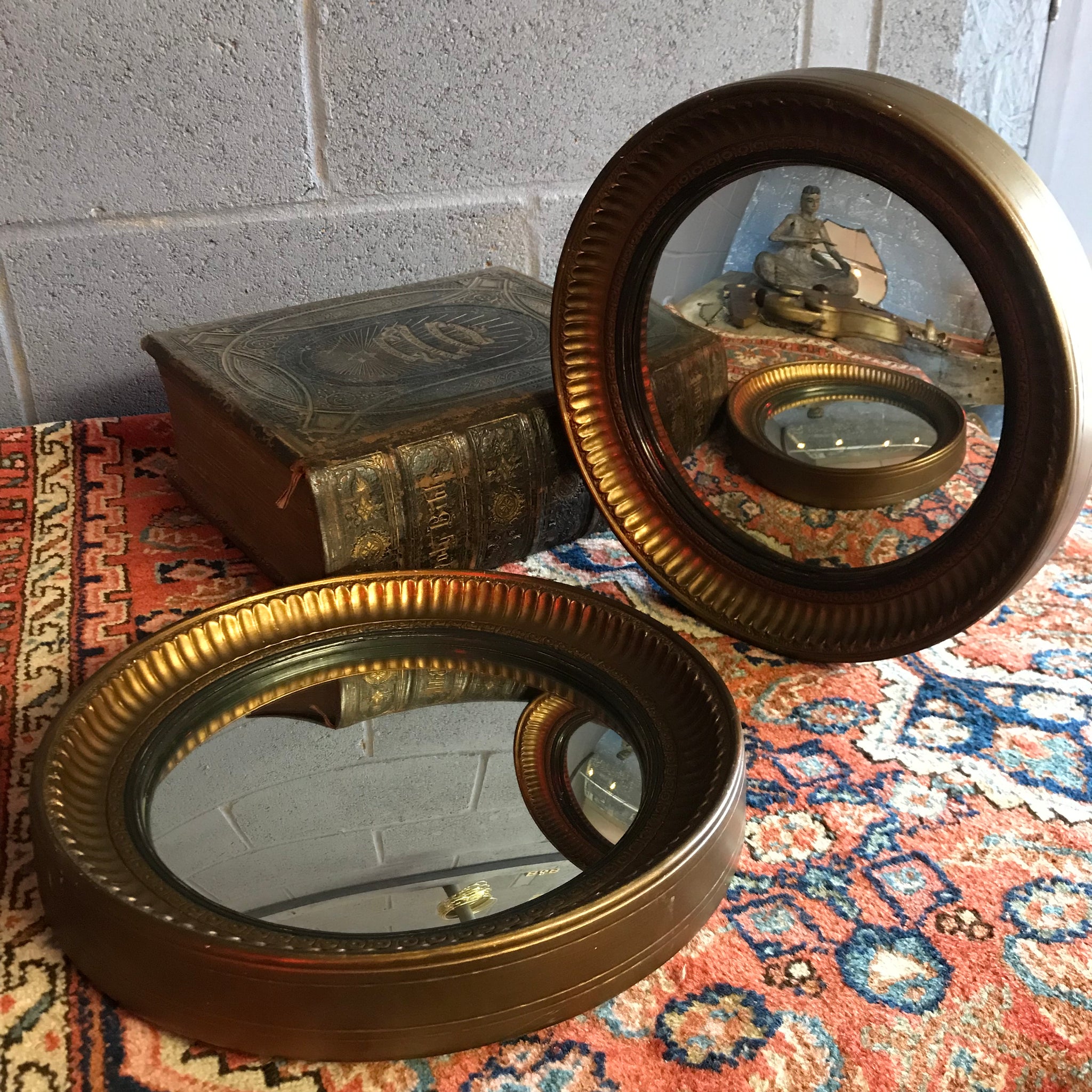 A rare pair of gilt convex ball mirrors