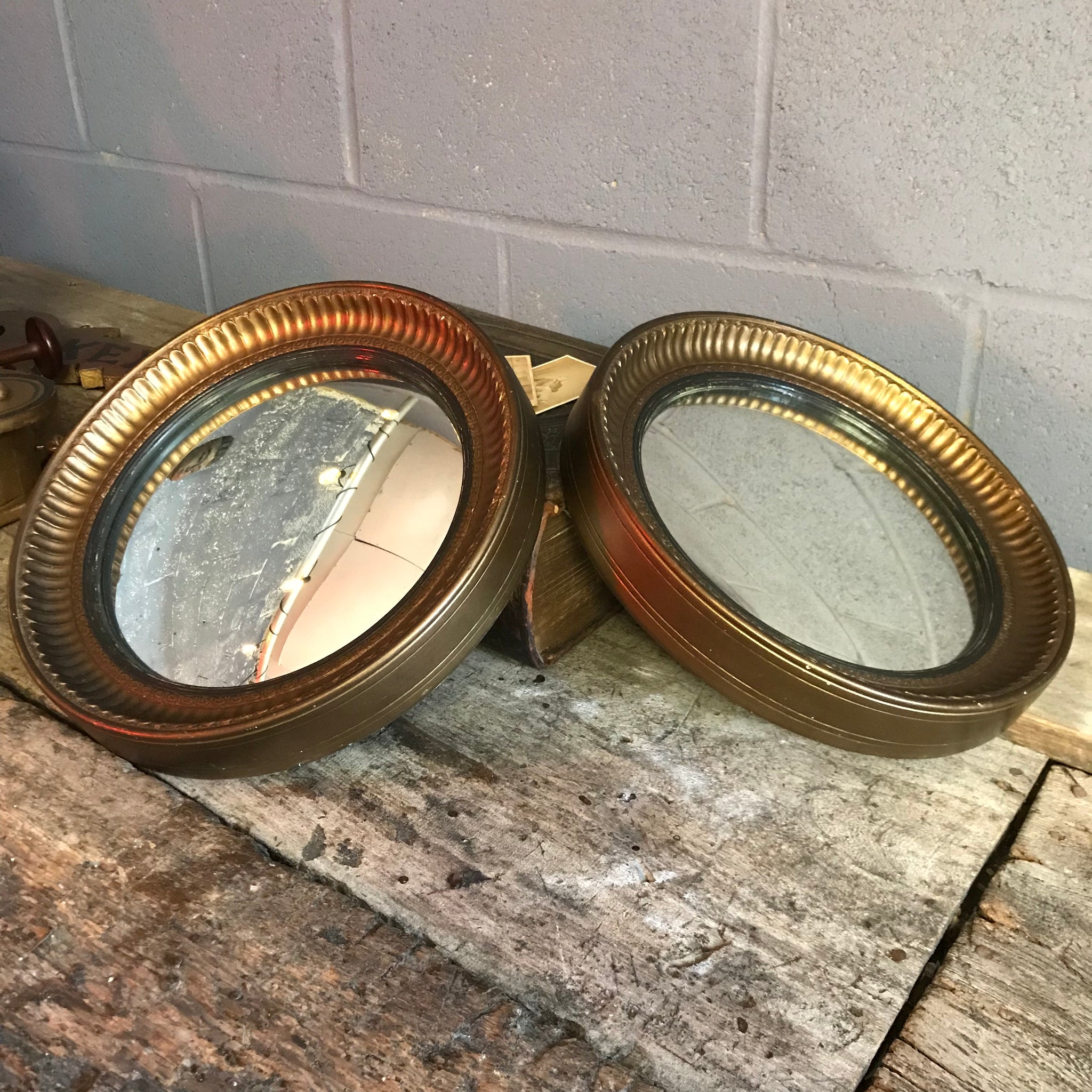 A rare pair of gilt convex ball mirrors