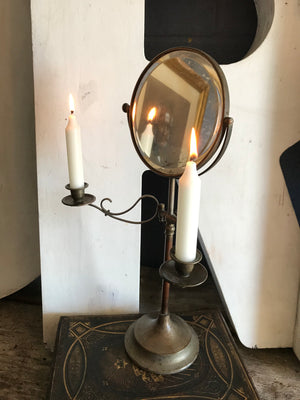 An adjustable shaving mirror - free standing or wall mounted - with candle sconces