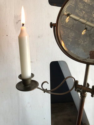 An adjustable shaving mirror - free standing or wall mounted - with candle sconces