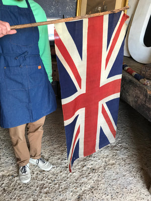 A large pair of early linen Union Jack flags on poles