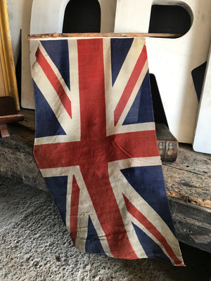 A large pair of early linen Union Jack flags on poles